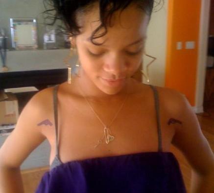 There are her new gun tattoos! I'll probably never get a tattoo like this,